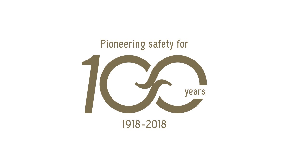 Logo 100 years Spanninga gold on white