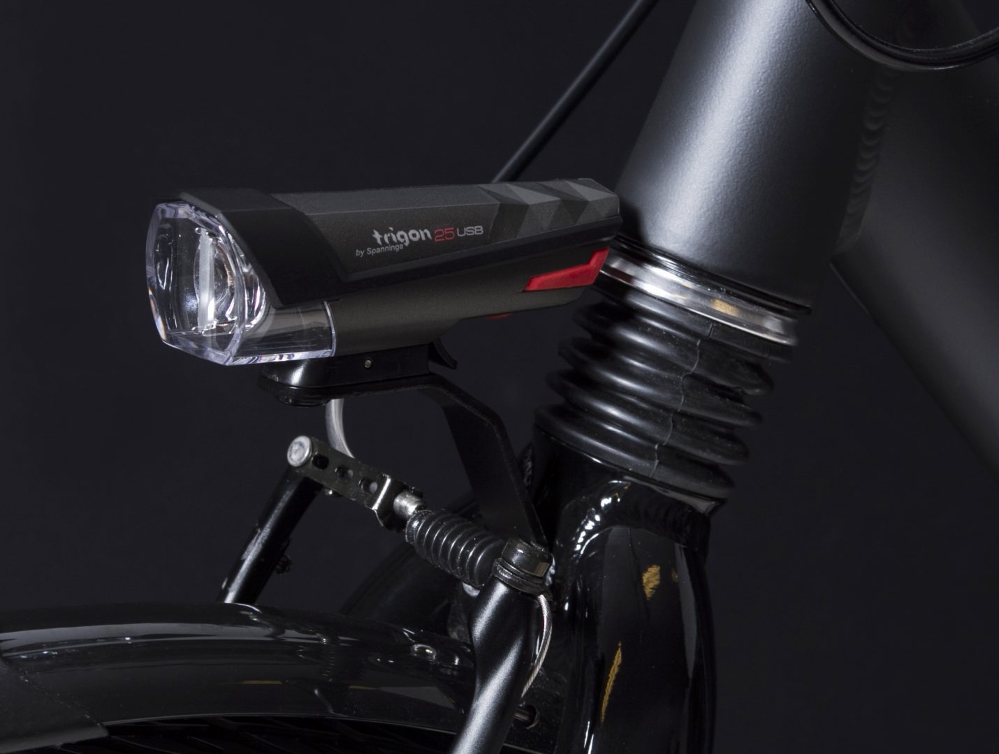 Trigon 25 Usb headlamp on front fork with Br 500 close up
